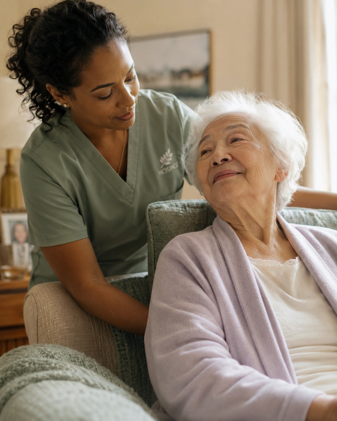 A hospice nurse providing gentle comfort care to a patient
